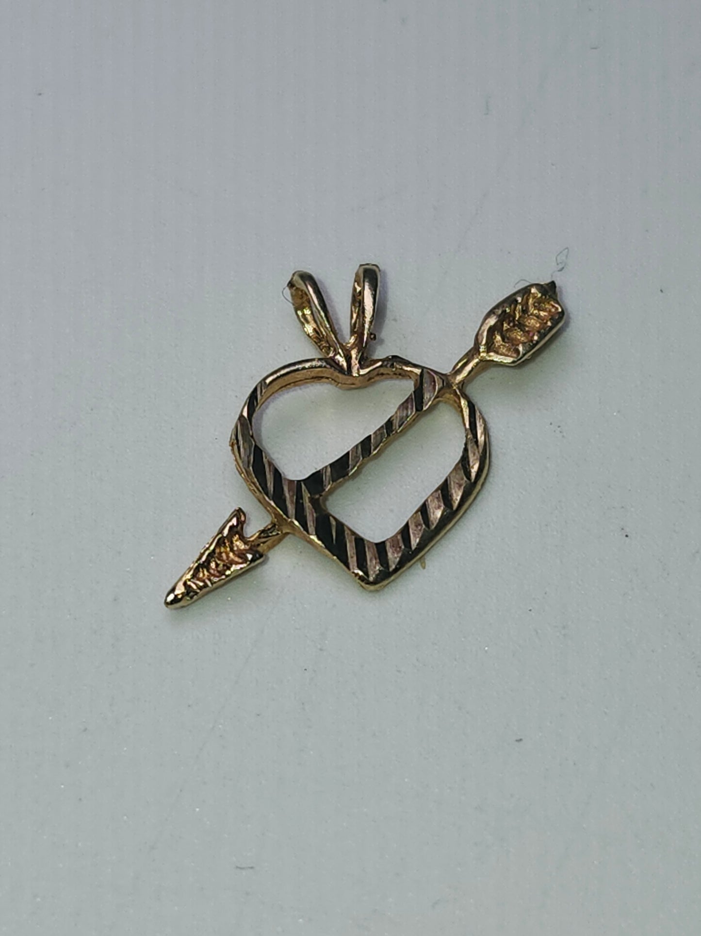14K Gold Arrow Through Heart Diamond Cut Pendant